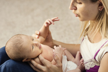 Mother caring for small baby