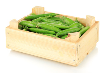 Sweet green peas in wooden box isolated on white