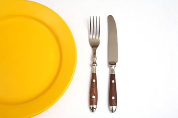 Cutlery and plate isolated with white background