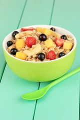 Oatmeal with fruits on table close-up