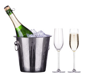 glass and bottle of champagne in ice bucket