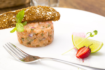 meat salmon with lemon on a table in a restaurant
