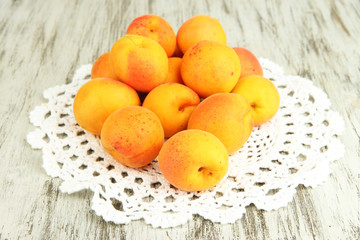 Naklejka na ściany i meble Fresh natural apricot on wooden table close up