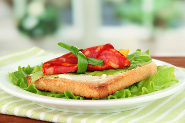 Salami rolls with paprika pieces inside,