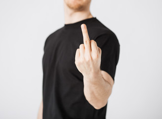 man showing middle finger