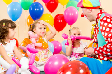 Fototapeta na wymiar kids group and clown on birthday party