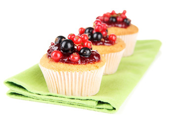 Tasty muffins with berries isolated on white
