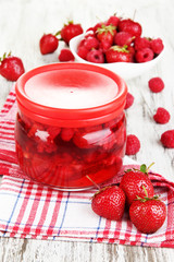 Home made berry jam on wooden table