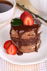 Chocolate cake with strawberry on table close-up