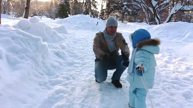 Child rolls the sled yourself to meet his father