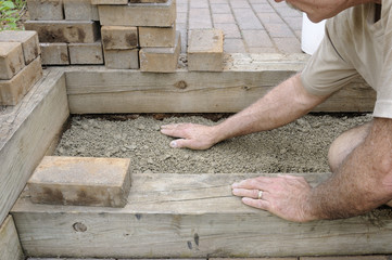 Worker Installing Brick Steps