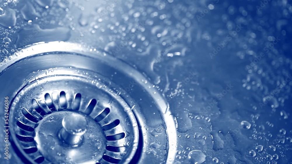 Sticker bubbly flow of water in the sink closeup