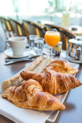 Breakfast with coffee and croissants