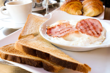 Breakfast with coffee and croissants