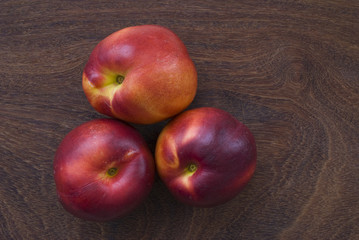 Fototapeta na wymiar peach on wooden background