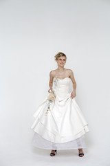 Fototapeta na wymiar Beautiful blonde bride wearing wedding dress