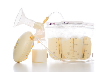 breast pump and bags of frozen breastmilk