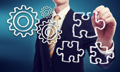 Business Man with Gears and Puzzle Pieces