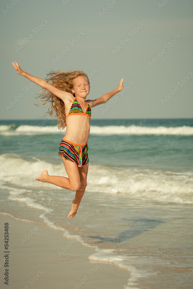 Poster flying jump beach girl on blue sea shore in summer vacation