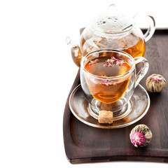 Green tea in a cup and teapot