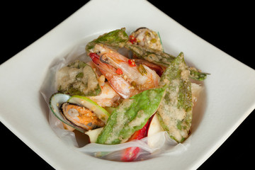 Mixed and spicy seafood salad with crispy vegetable.