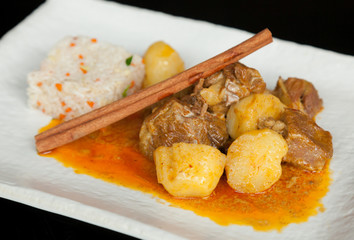 Spice curry meat with rice.