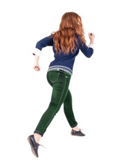 back view of jumping  woman  in  jeans.