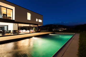 Modern villa, night scene,view from poolside