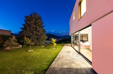 Fototapeta premium Modern villa with garden, night scene
