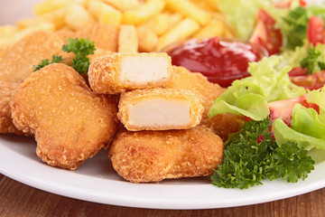 chicken nuggets,french fries and salad