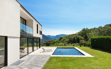 Modern villa with pool, view from the garden - obrazy, fototapety, plakaty