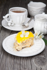 Sweet cake on dark wooden table