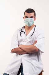 Portrait of young doctor with mask and stethoscope
