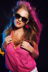 Sensual retro 80s fashion disco girl with long blonde hair and s