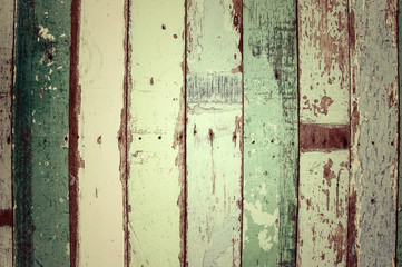 Old vintage colorful paint over wood.