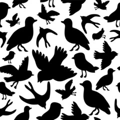 Seamless pattern with silhouettes of birds