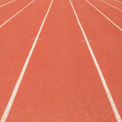 Fototapeta premium Lanes of a red race track in the stadium