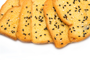 Baked bread, buttered and sesame