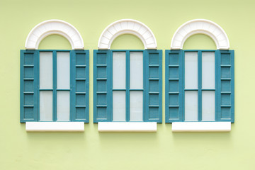 vintage windows on the green wall