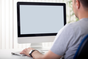 Man looks at the screen.