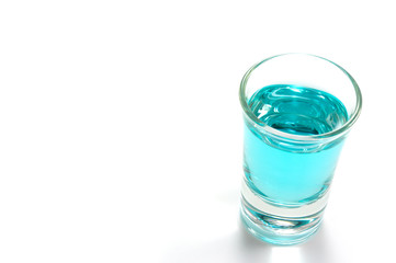 blue tonic in shot glass