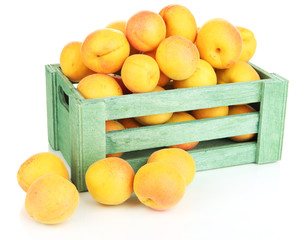 Fresh natural apricot in wooden box isolated on white
