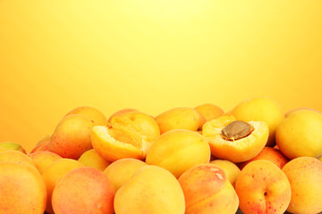 Fresh natural apricot on orange background