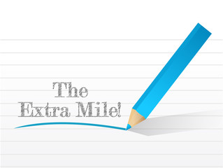 the extra mile sign written on a notepad