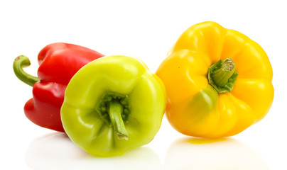 fresh yellow, red and green bell peppers isolated on white