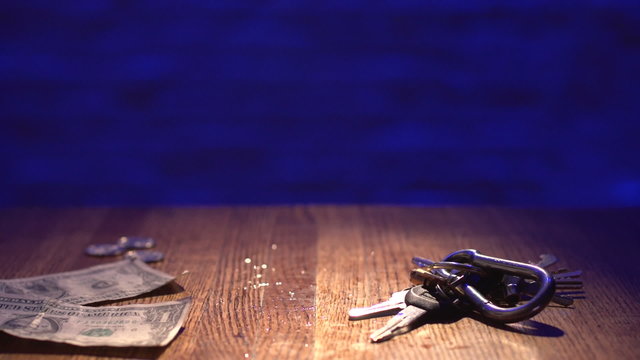 Man finishes an alcoholic drink and then grabbing keys