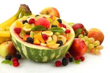 Fotobehang fresh fruits salad in watermelon, fruits and berries, isolated © Africa Studio