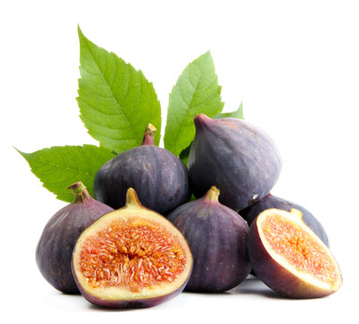 Ripe sweet figs with leaves isolated on white