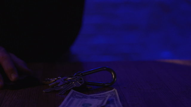 Keys and money laying around, horizontal