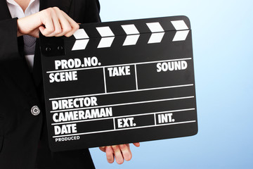 Movie production clapper board on color background